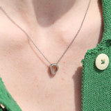 Letter silhouette necklace.