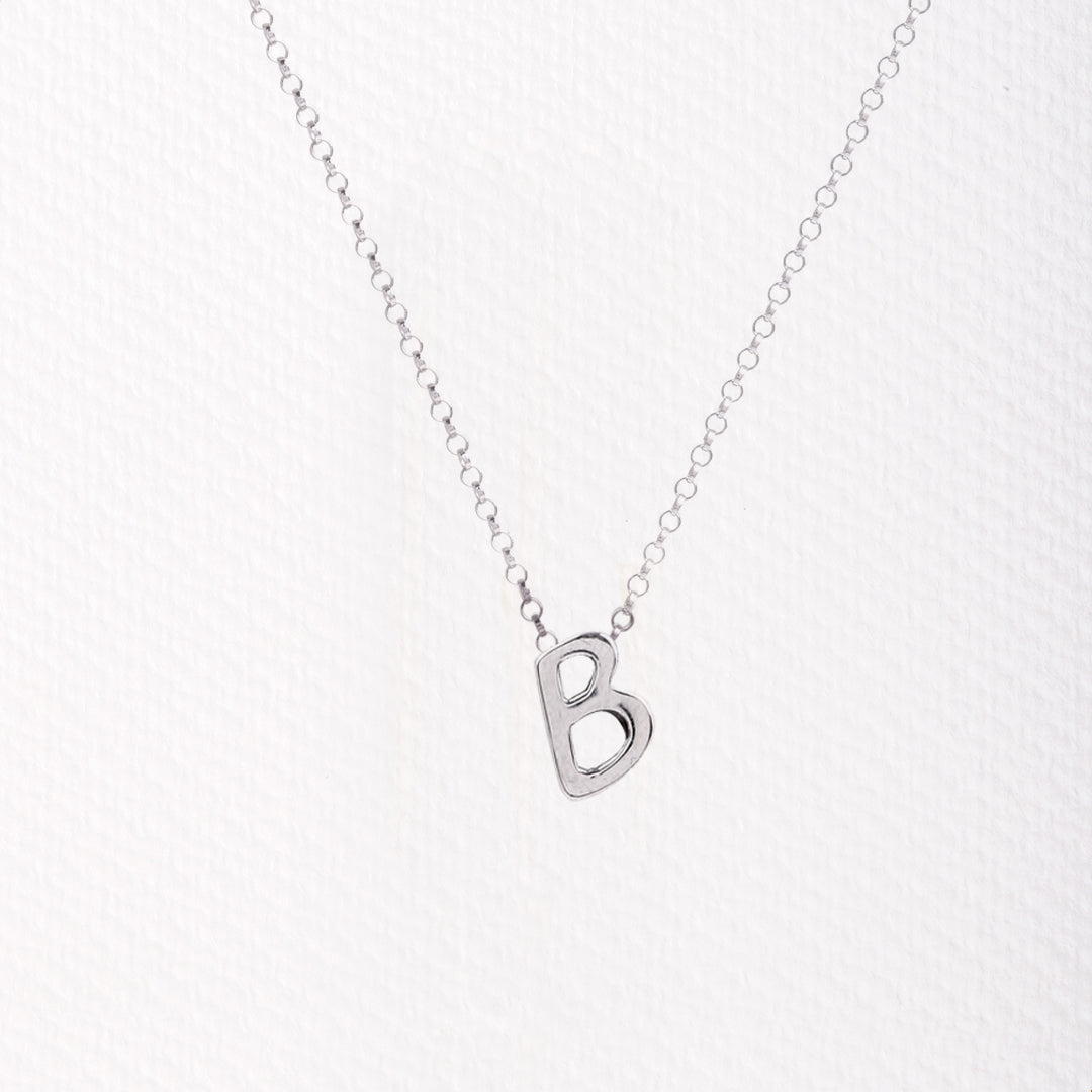 Letter silhouette necklace.