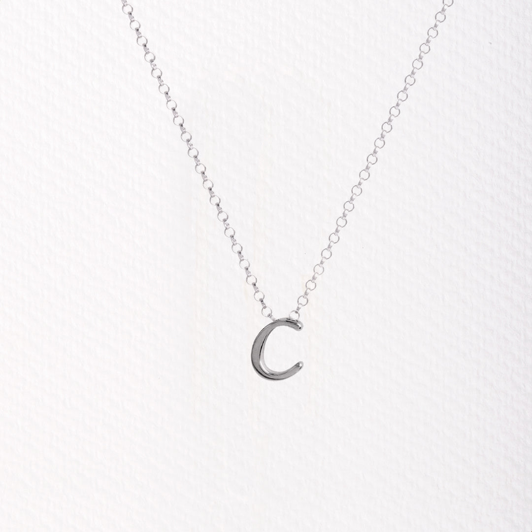 Letter silhouette necklace.