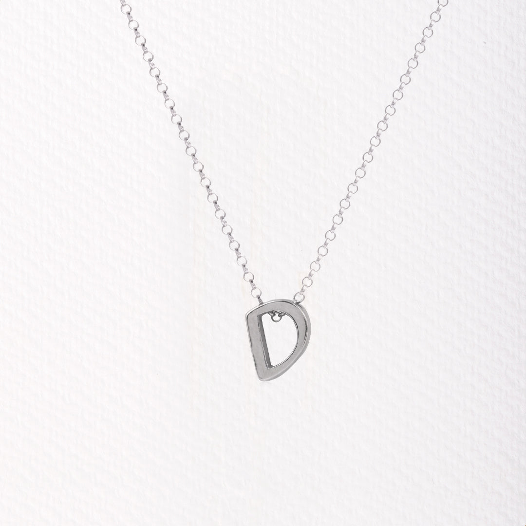 Letter silhouette necklace.