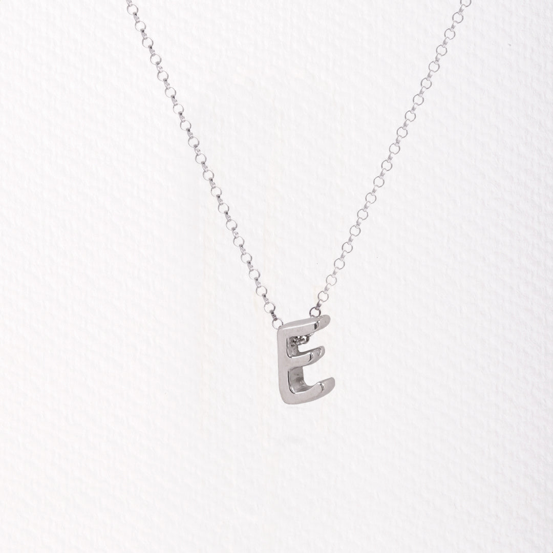 Letter silhouette necklace.