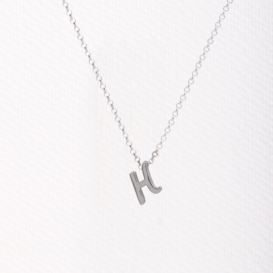 Letter silhouette necklace.