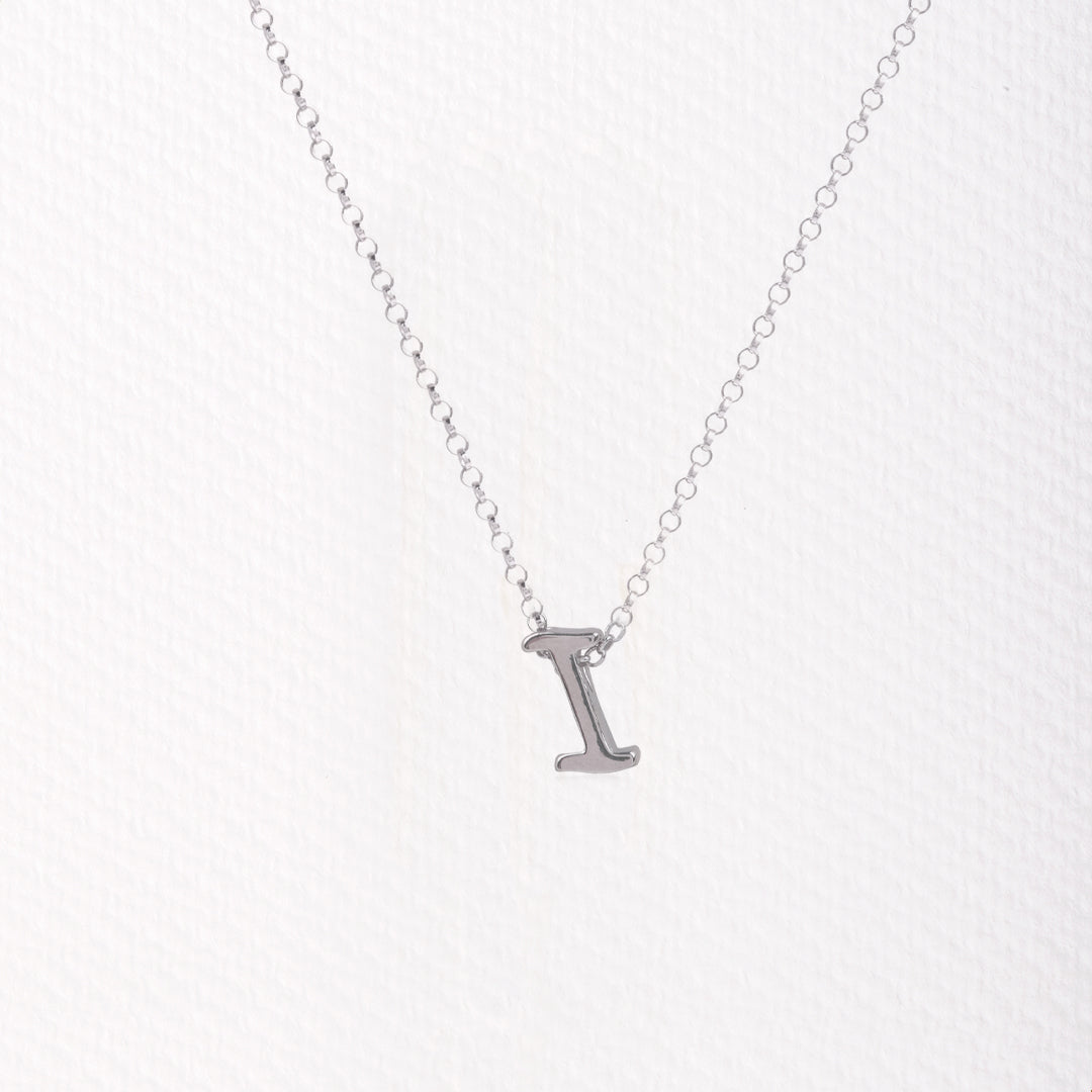 Letter silhouette necklace.