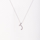 Letter silhouette necklace.