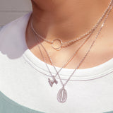 Letter silhouette necklace.