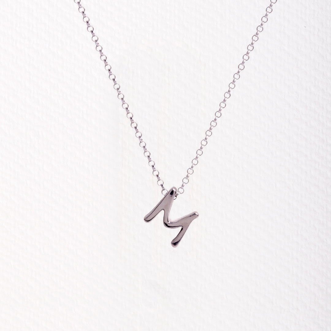 Letter silhouette necklace.