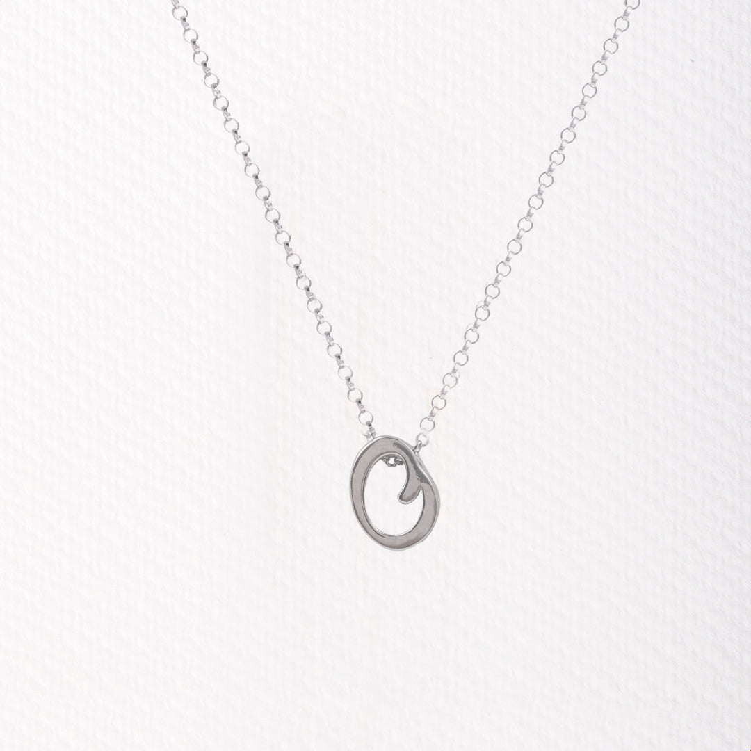 Letter silhouette necklace.