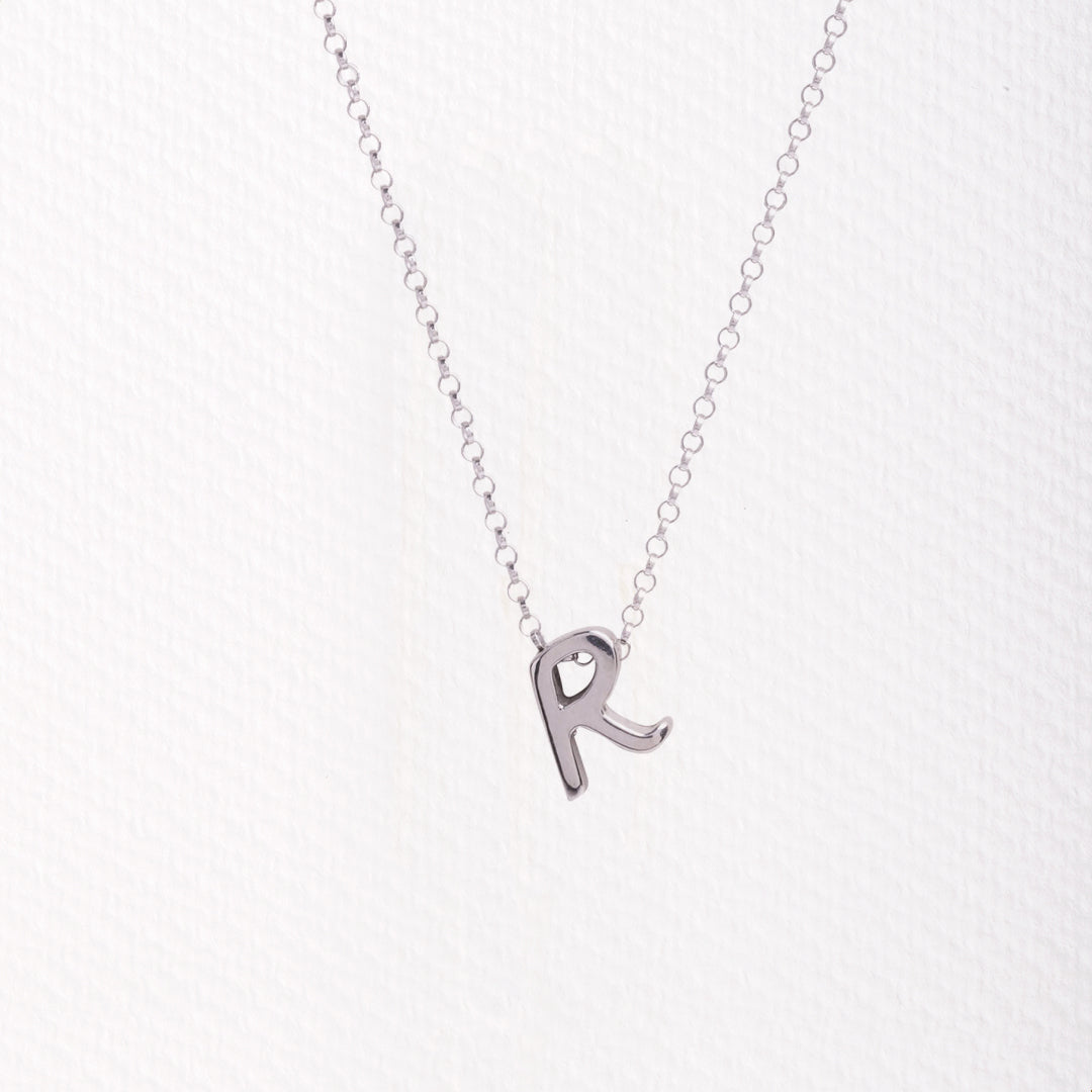 Letter silhouette necklace.