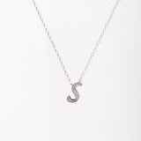 Letter silhouette necklace.