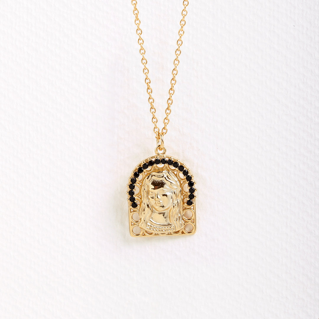 Virgin Mary necklace.