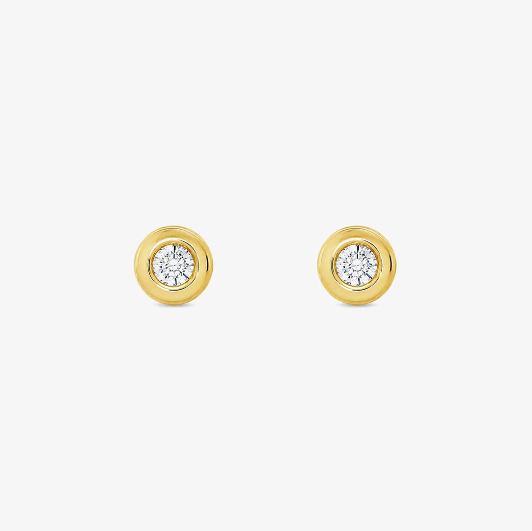 Diamond bezel stud earrings.