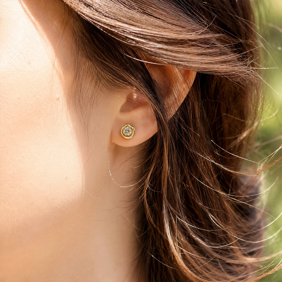 Diamond bezel stud earrings.